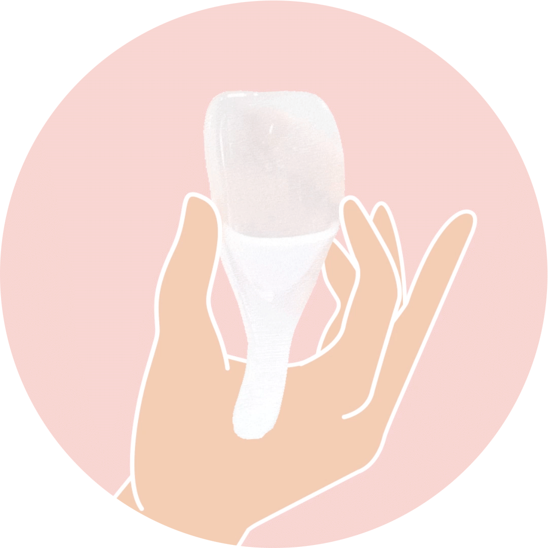 hand squishes Sperm Guide at-home conception kit to show it is soft and springy to be inserted into vagina