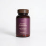 A bottle of 'Fertility Complete for Him' supplements by twoplus Fertility, with a purple label on a white background