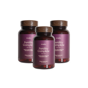 Three bottles of 'Fertility Complete for Him' supplements by twoplus Fertility, with a purple label on a white background
