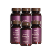Six bottles of 'Fertility Complete for Him' supplements by twoplus Fertility, with a purple label on a white background