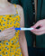 woman holds positive pregnancy test twoplus Fertility